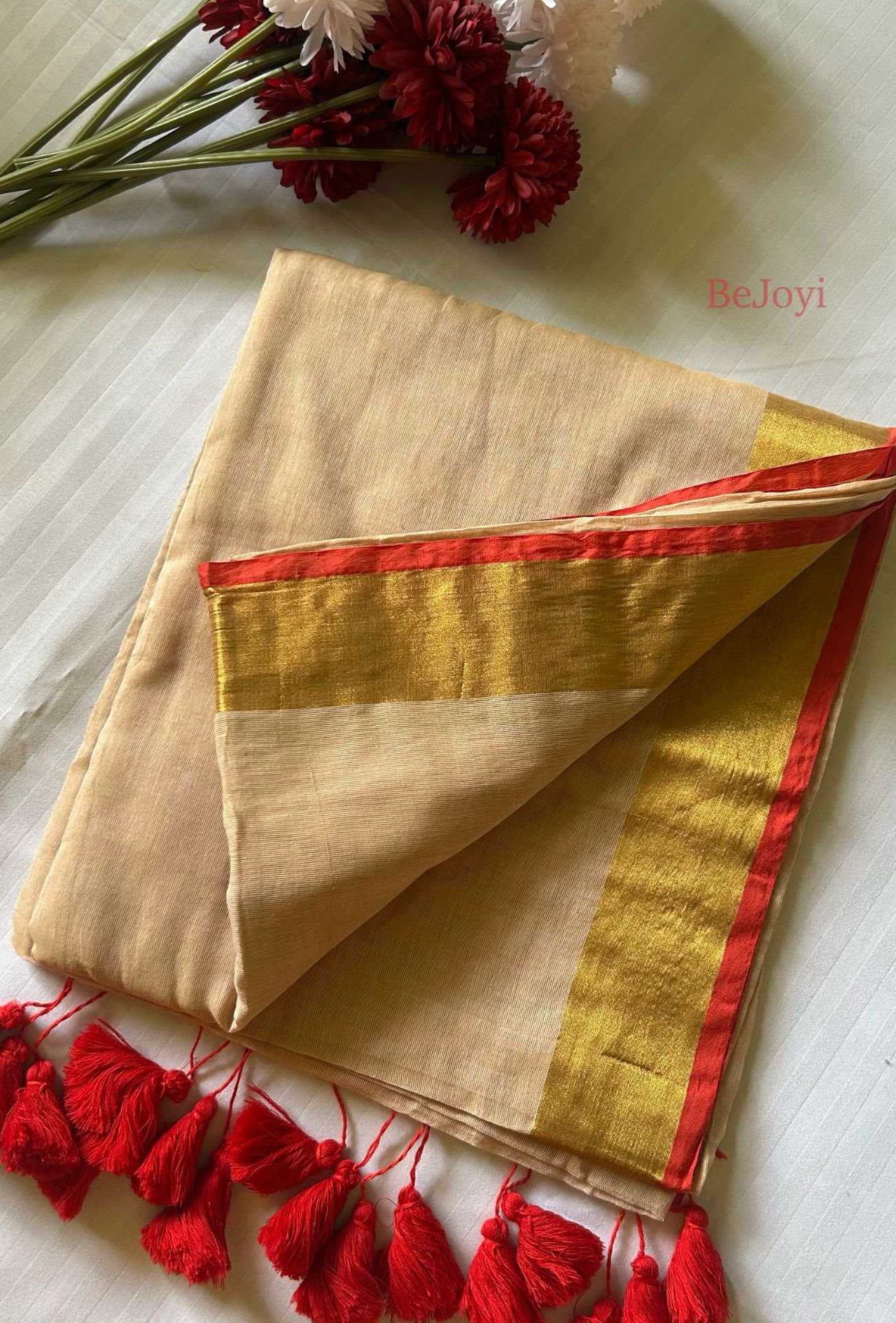 Devika – Sandalwood Beige Gold Zari Red Border Mulmul Saree